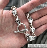 Серебряный мужской браслет с черепами с натуральными гранатами - Киев