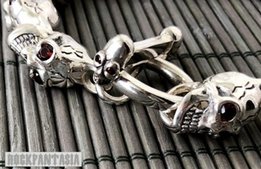 Серебряный мужской браслет с черепами с натуральными гранатами - Киев